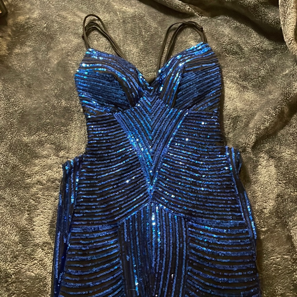 This is a dark sparkly blue prom dress. It’s a mermaid dress and fits perfect.